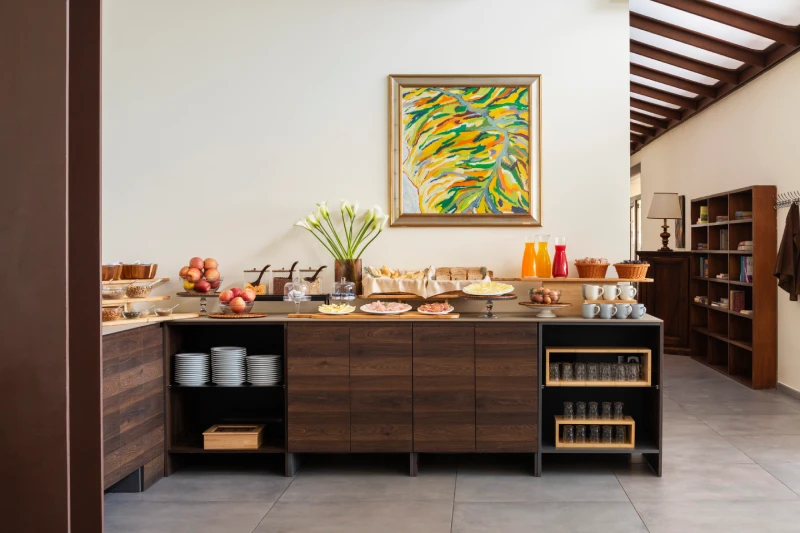 Breakfast buffet with bread, fruit and drinks in a bright room, perfect to start your day in Liguria - Hotel Al Sant'Andrea, BZAR hotels in Liguria
