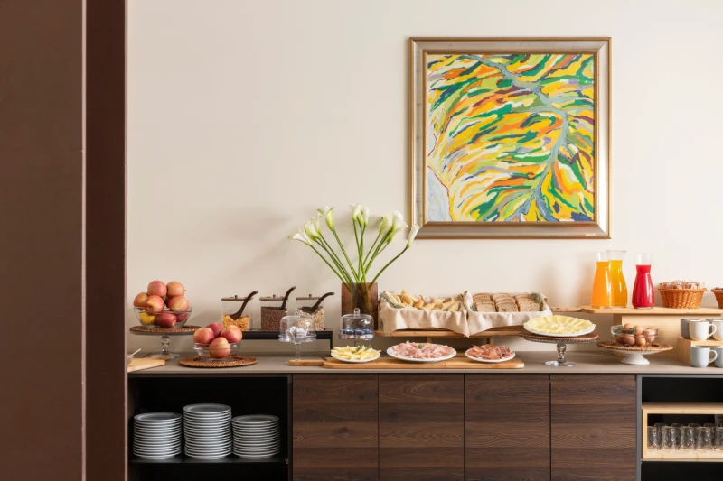 Breakfast selection with cold cuts, cheeses, fresh bread and juices, ideal for a stay in Sarzana, Liguria - Hotel Al Sant'Andrea, BZAR hotels in Liguria
