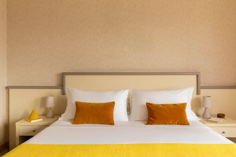 Superior room with double bed and warm details, relaxing atmosphere in Sarzana for a Liguria stay - Hotel Al Sant'Andrea, BZAR hotels in Liguria